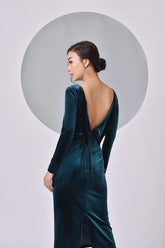 Velvet midi dress with long sleeves and dramatic low back for evening elegance